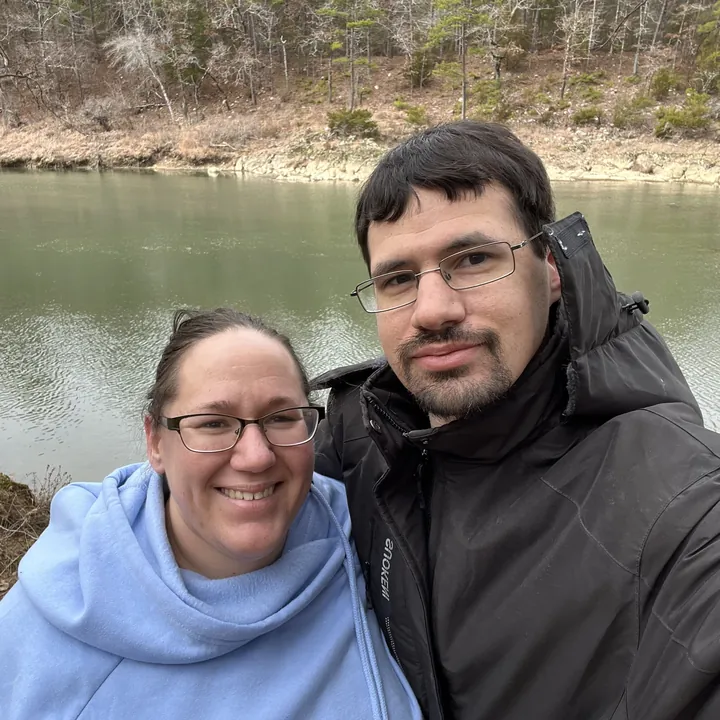 Keith and Emily by a river in winter
